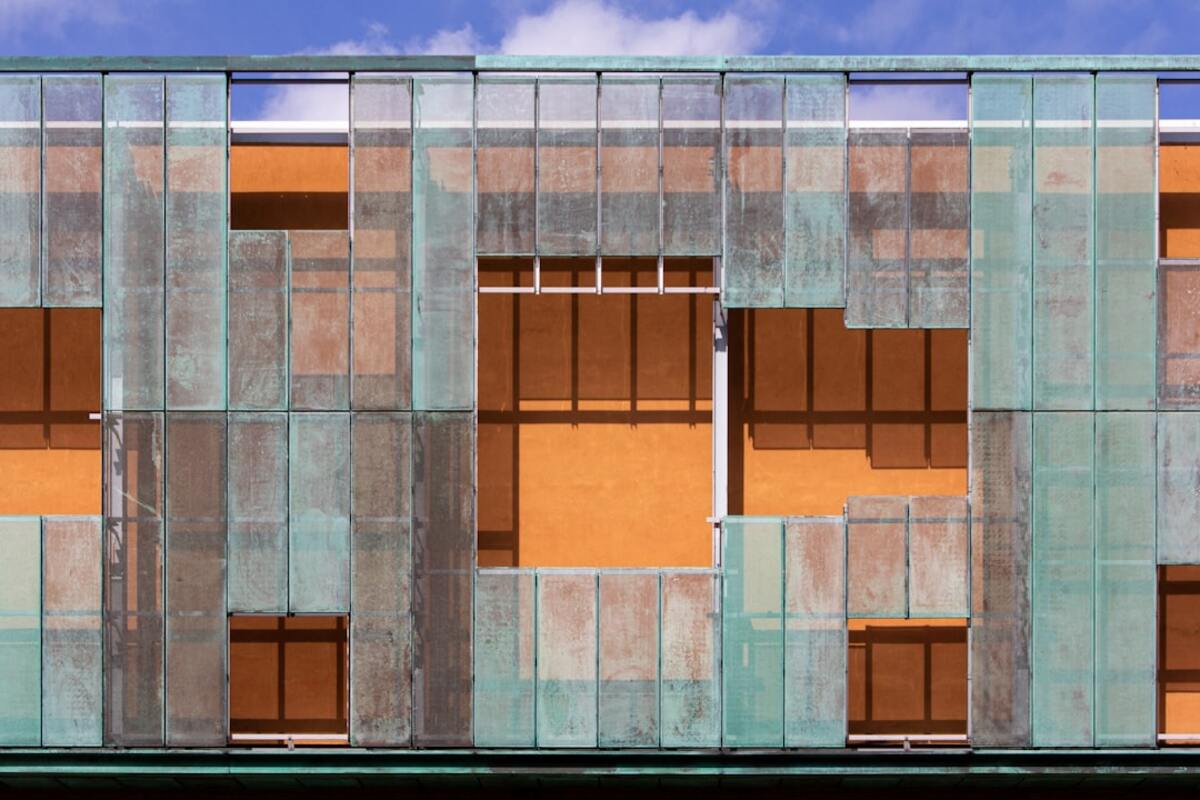 Snap-On Facades: Prefab Overcladding Retrofits for Mid‑Century Concrete Blocks